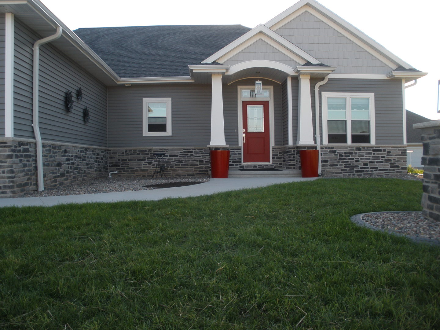 Red Fiberglass Planter In Front Of Door